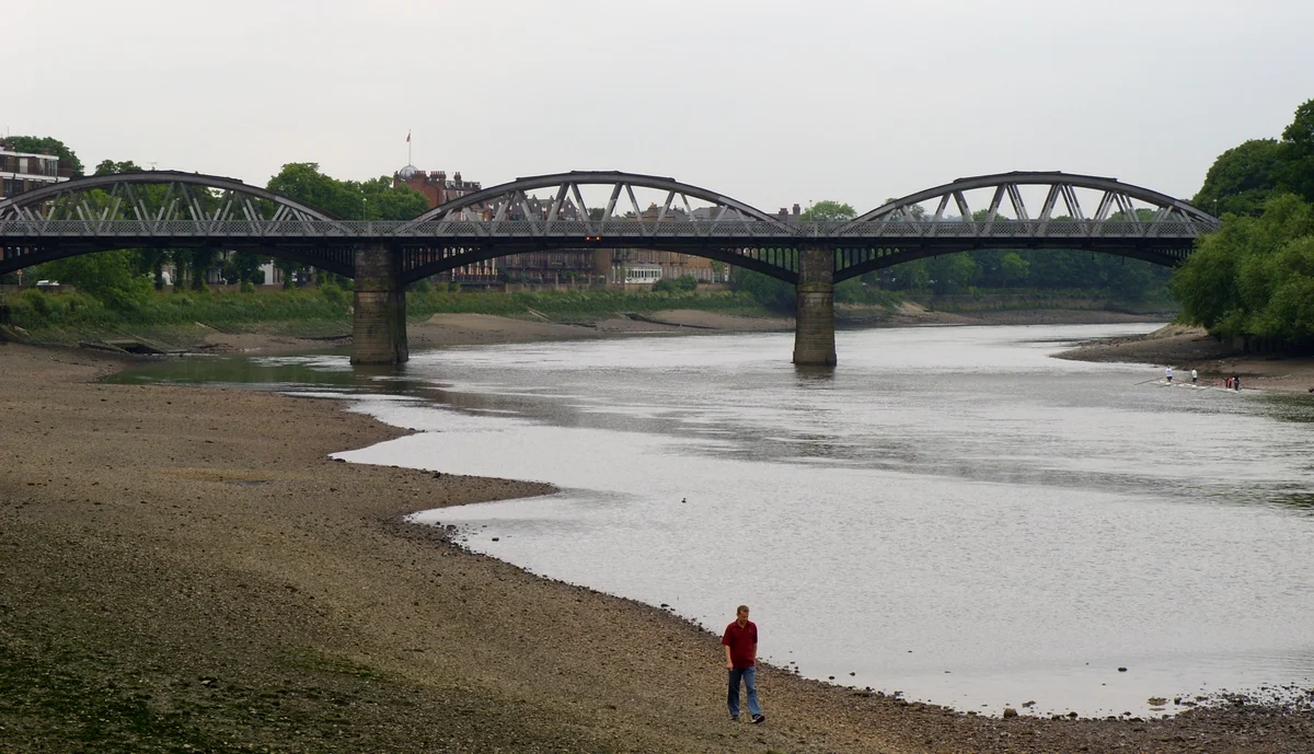 Barnes Railway Bridge at low tide, showing the cast iron arches